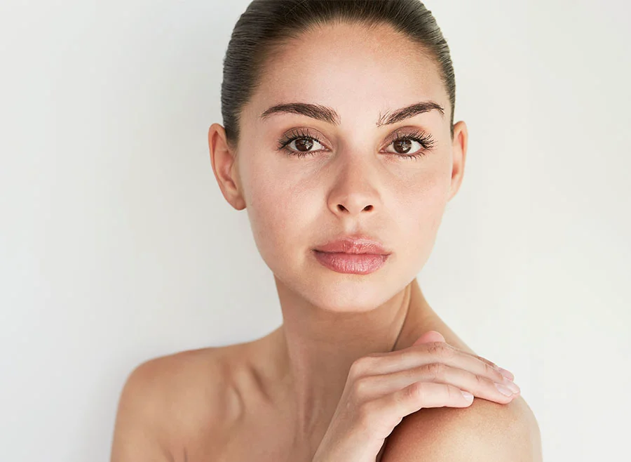 Close-up of a woman with smooth, flawless skin and a poised expression - Radiesse in Chino, CA